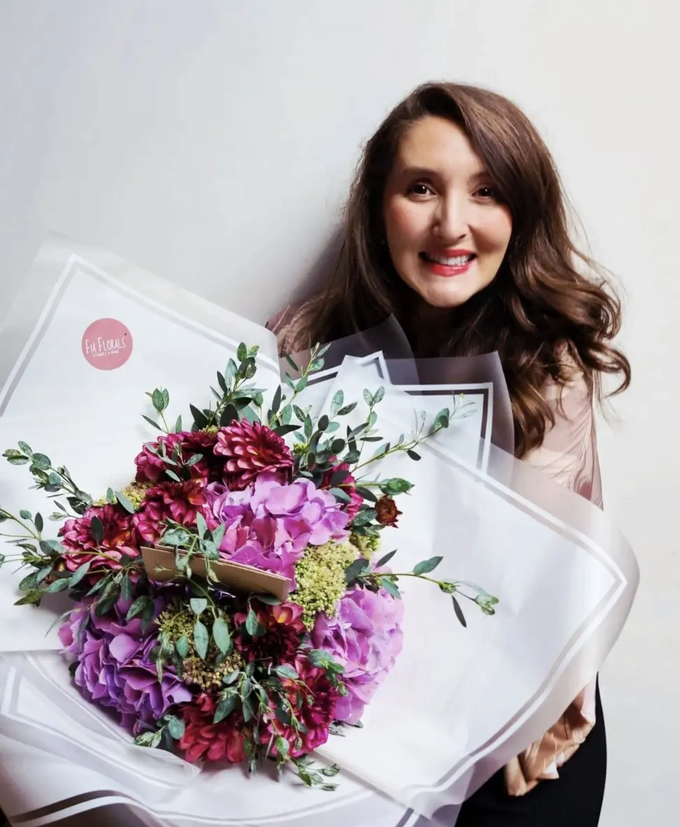 Sophia with a dahlia and purple hydrangea bouquet